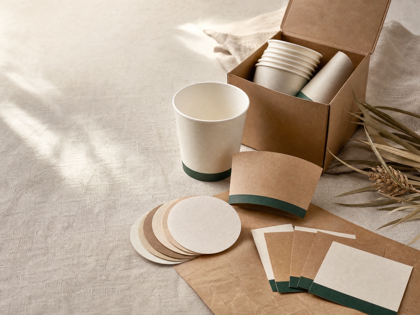Unbranded coffee cup, box and packaging sample kit arranged for review