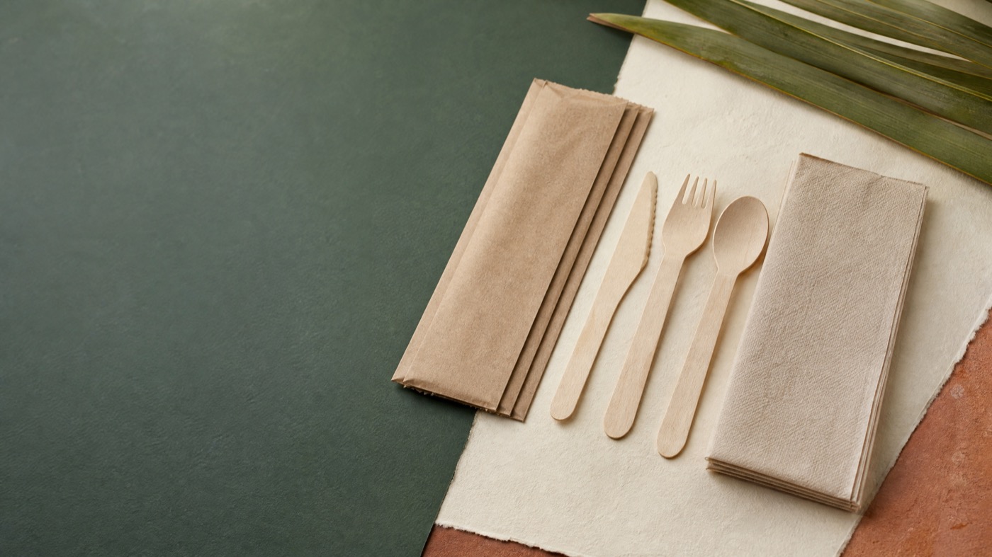 Unbranded wooden cutlery kits and service packaging samples for catering
